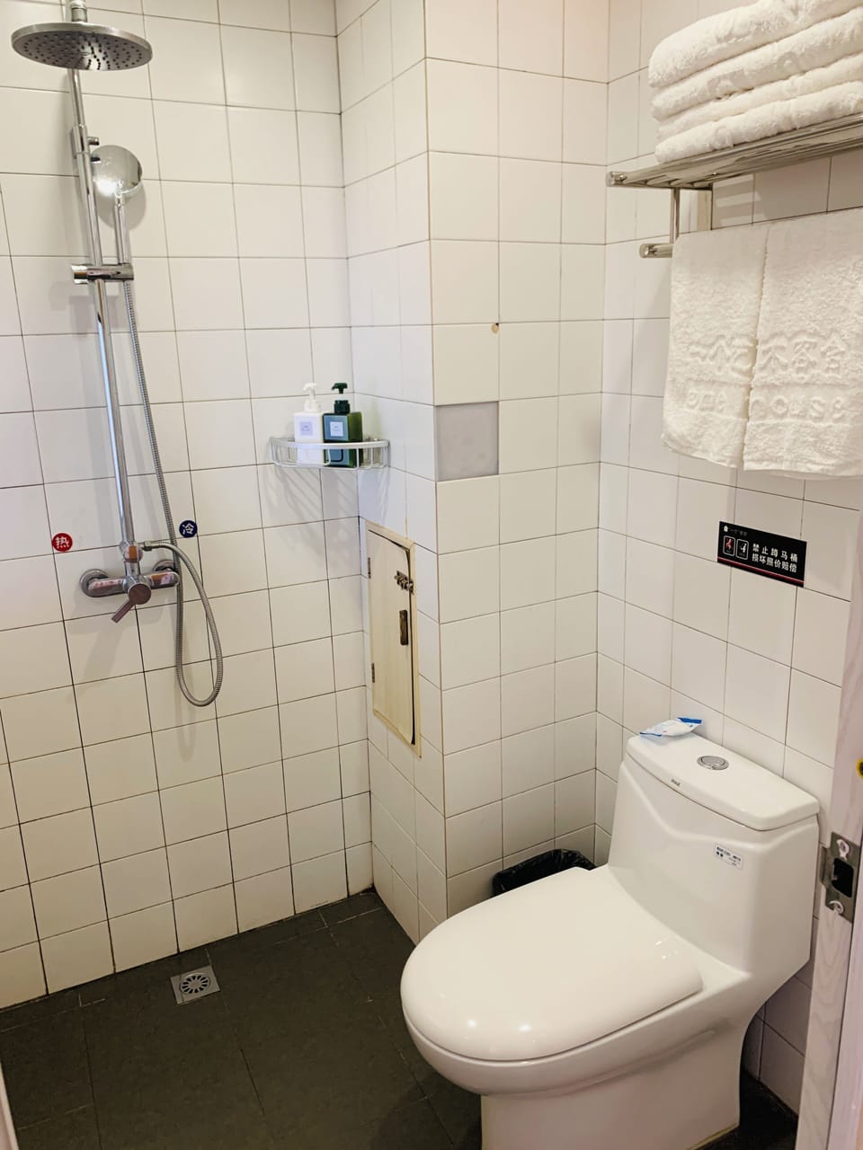Shower, hair dryer, slippers, towels
