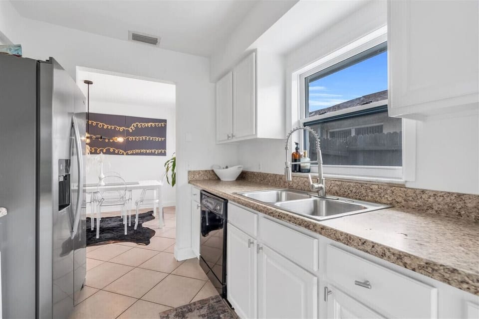 Kitchen: Bright and inviting, this stylish kitchen pairs modern appliances with chic decor!