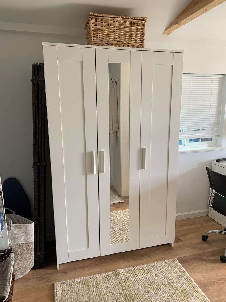 IKEA wardrobe w/shelves and rod for hanging clothes. Iron and board inside.