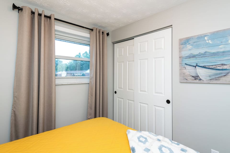 Rest easy in a plush queen-size bed, perfect for recharging after a day of adventures.