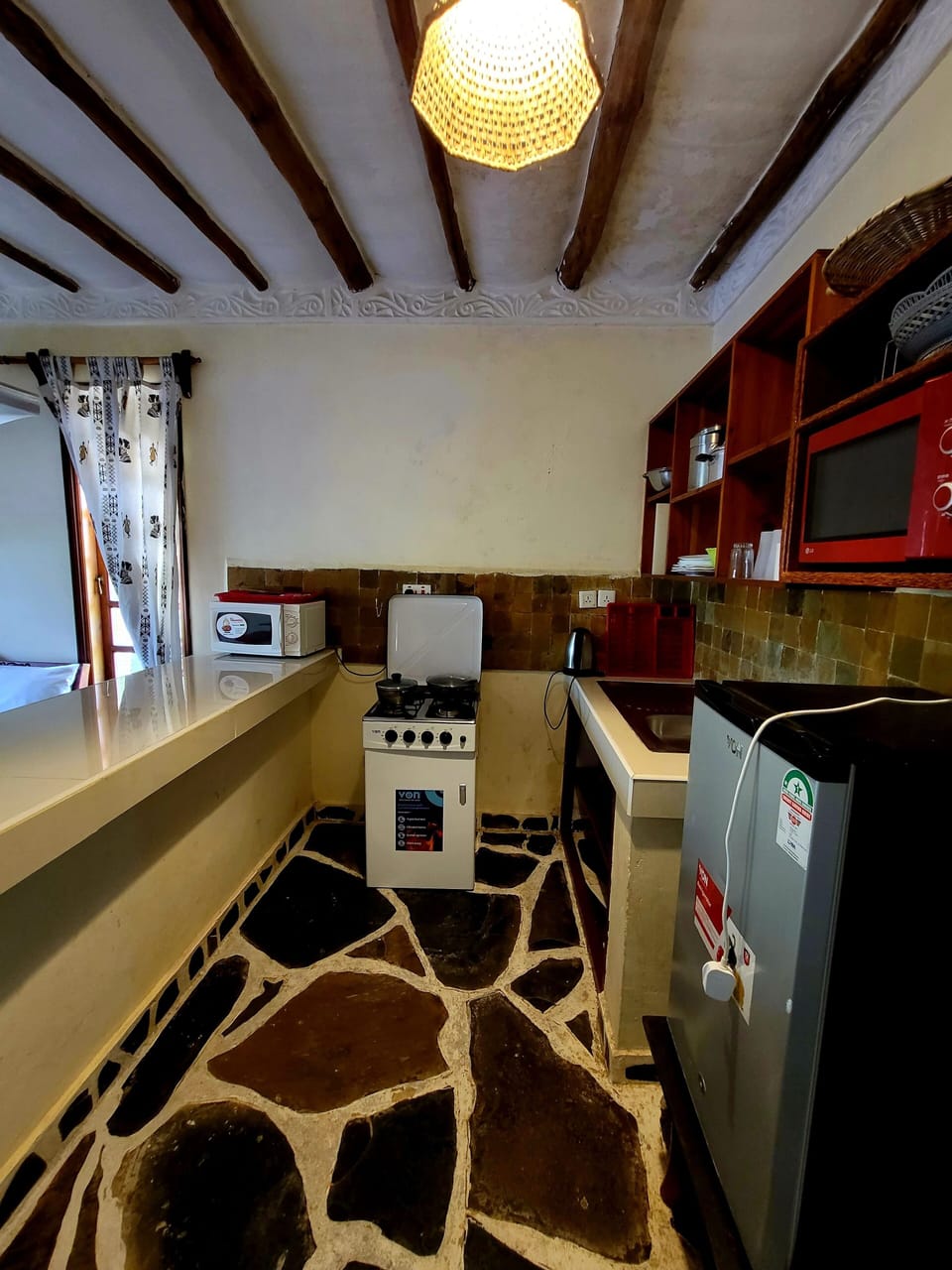 Apartment, Pool View | Private kitchenette | Mini-fridge, microwave, oven, stovetop