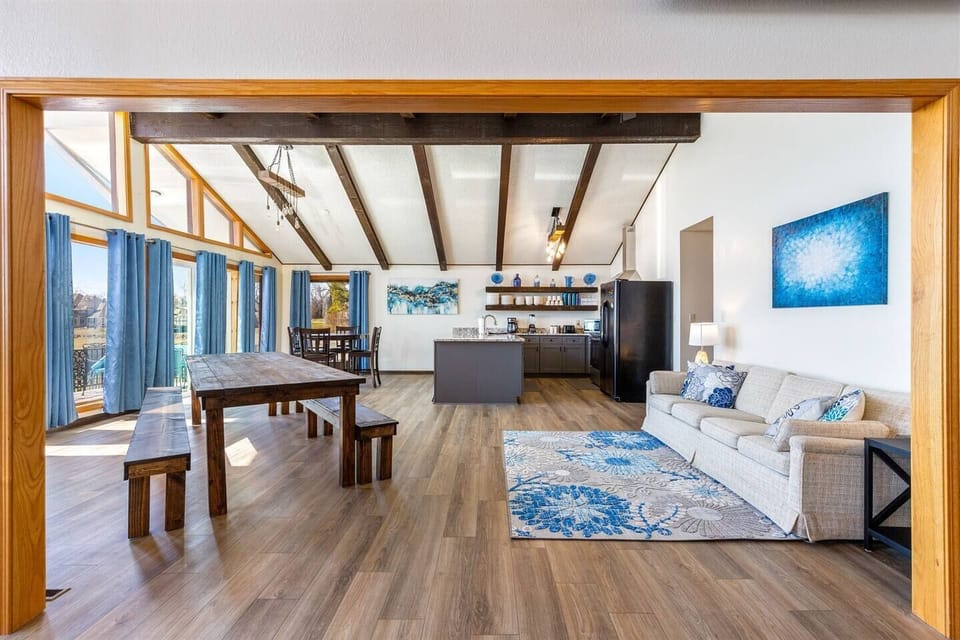 With a large farm table, bar seating, and high boy table, there is plenty of dining seating for the whole family. Sofa converts to 2 twin beds.