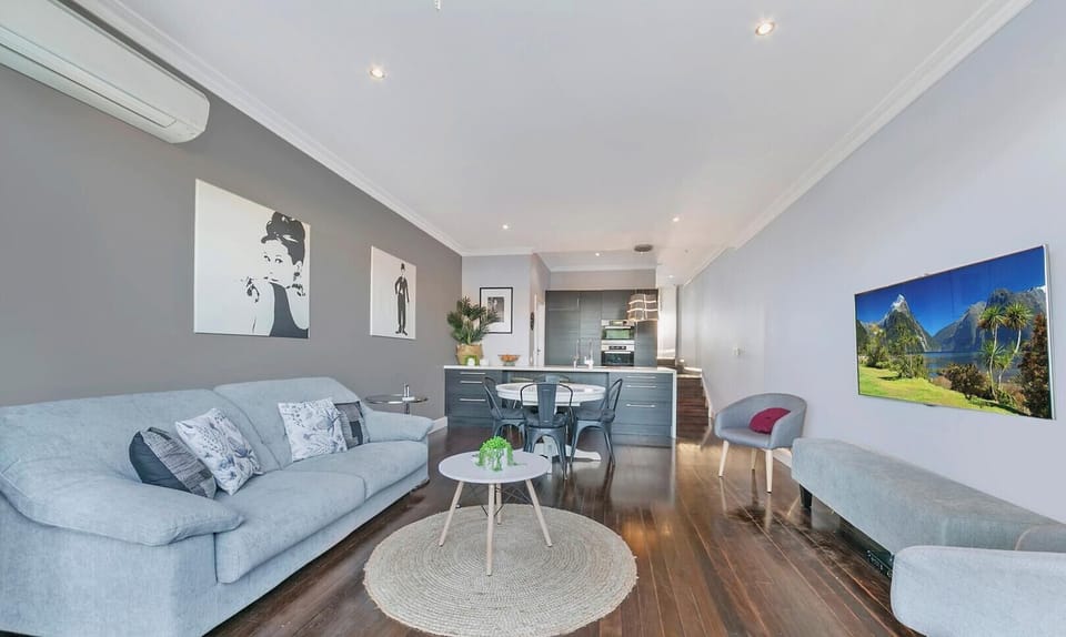 A spacious living area showcasing a contemporary layout and neutral color palette.