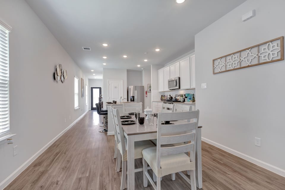 A spacious dining area that comfortably seats six, ideal for family meals. 