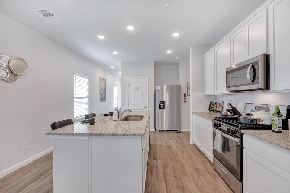 Enjoy the bar stools at our kitchen island!  Comfortably seats 8.