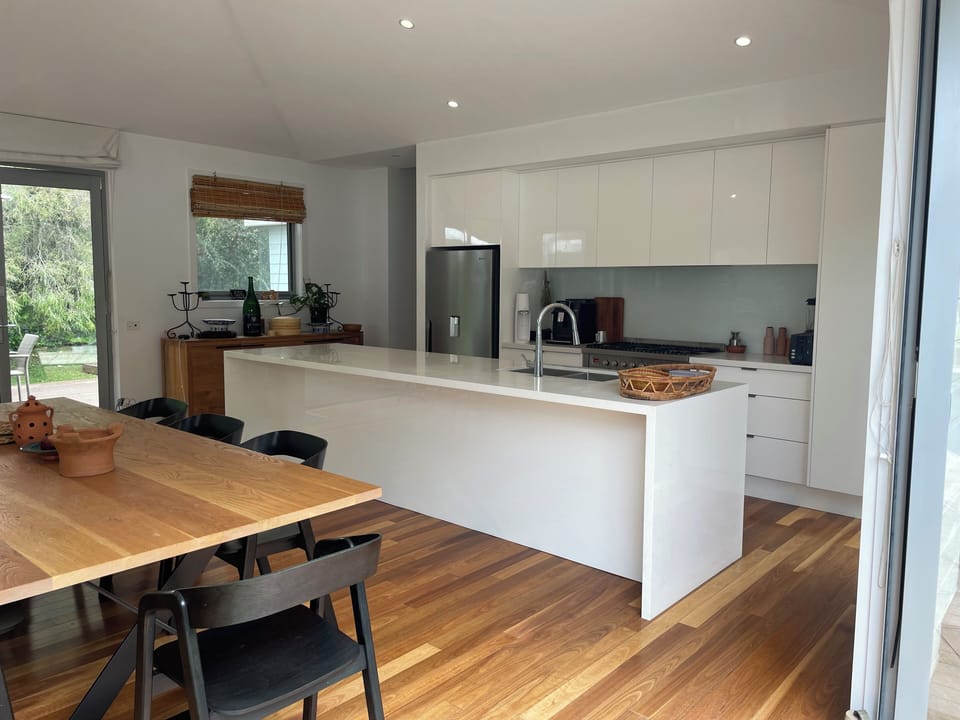 View of kitchen and main dining table from Northern Terrace.