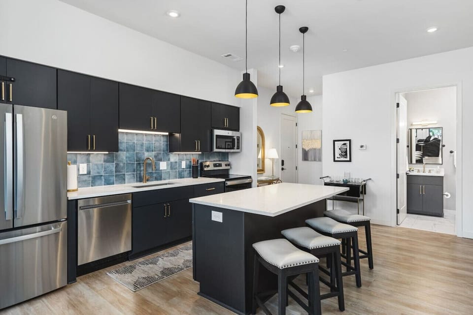 Brand new high-end appliances in this fully equipped kitchen. We provide all the cooking utensils you might need to enjoy a meal at home. Seating for four at the kitchen island.