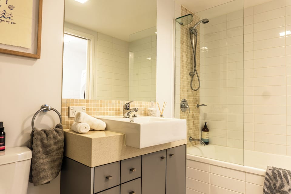 Main bathroom complete with bath tub and with generous amenities provided.  
