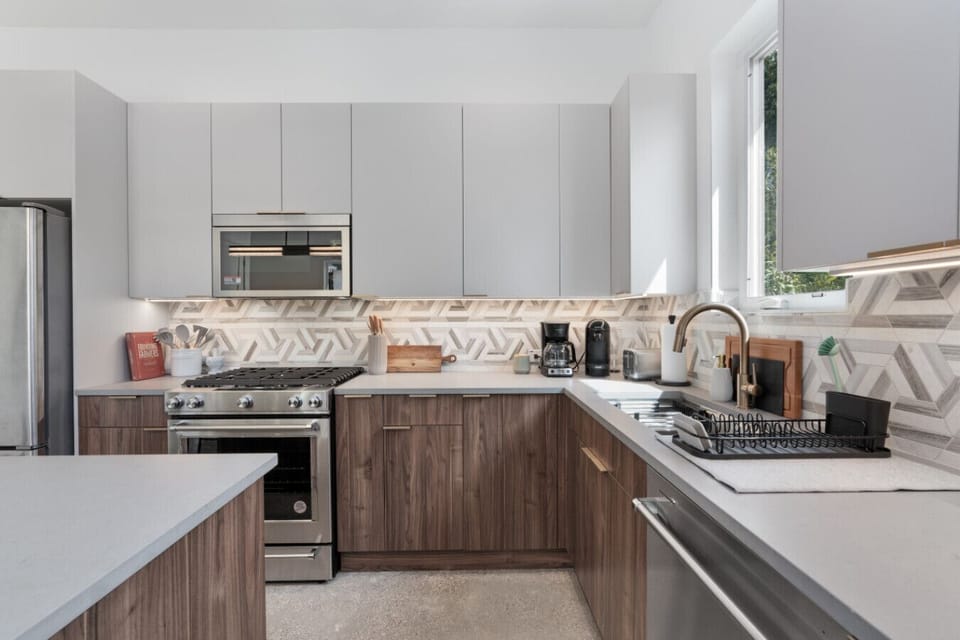 Modern kitchen featuring a spacious island, perfect for meal prep and casual dining.