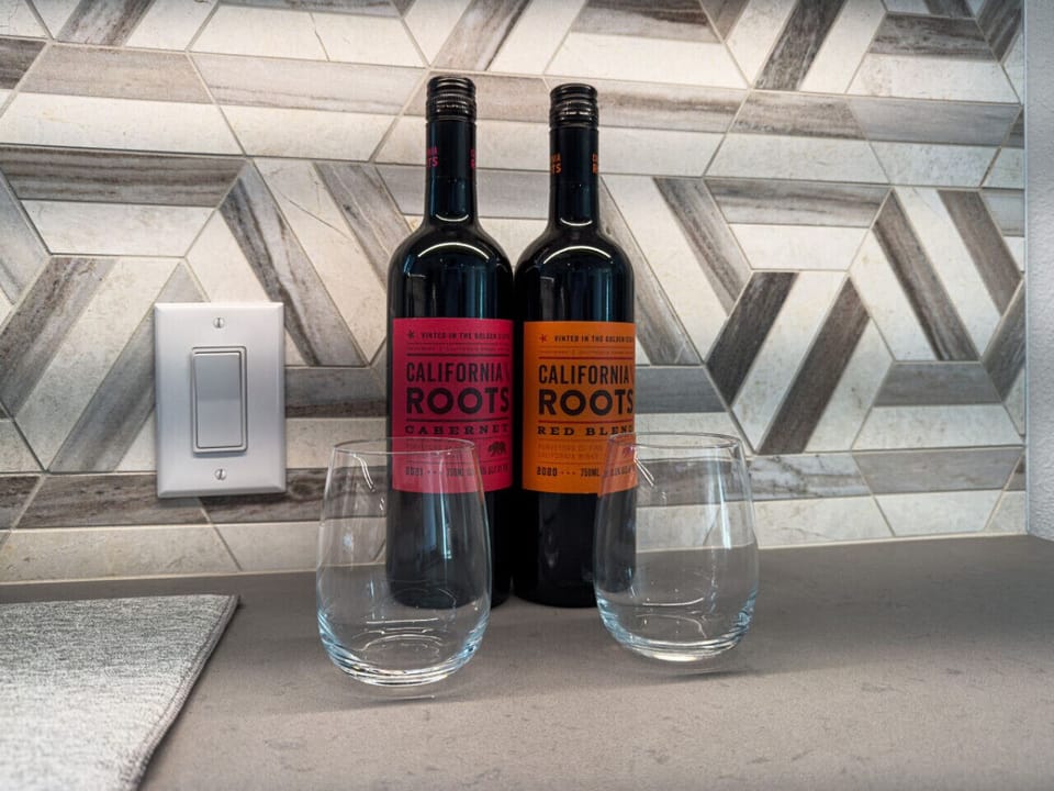 Sophisticated wine area complete with bartender tools, perfect for hosting.