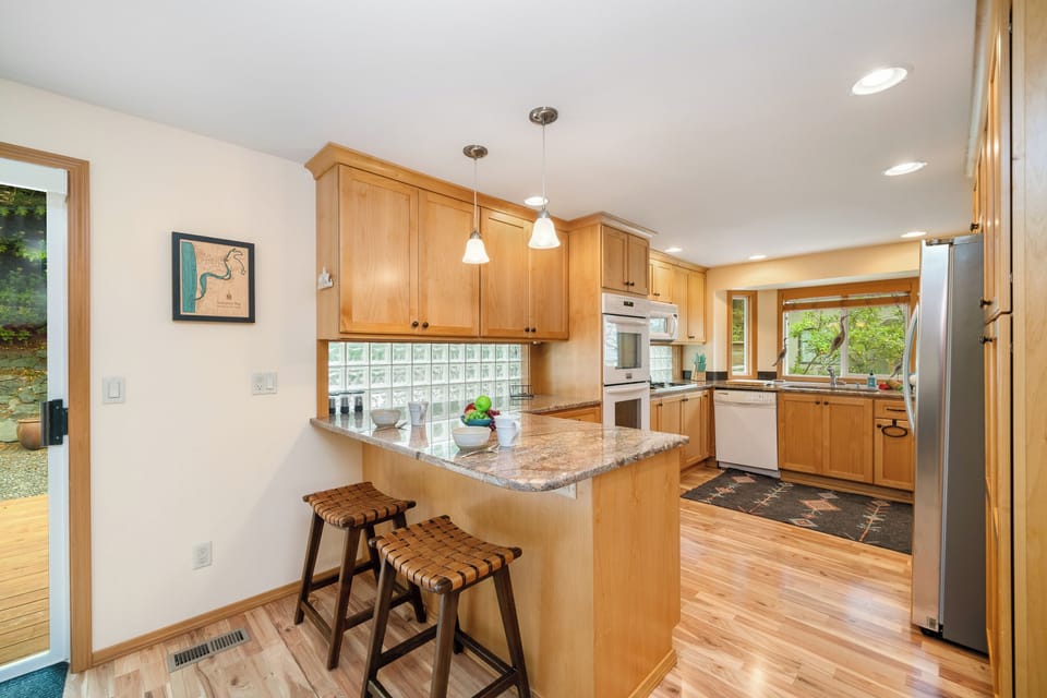 Gourmet kitchen with breakfast bar and open to the dining room.