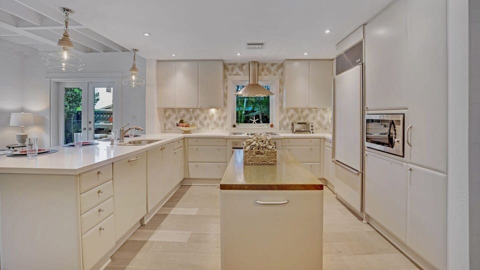 The state-of-the-art kitchen is absolutely stunning, with custom cabinetry and commercial grade appliances...