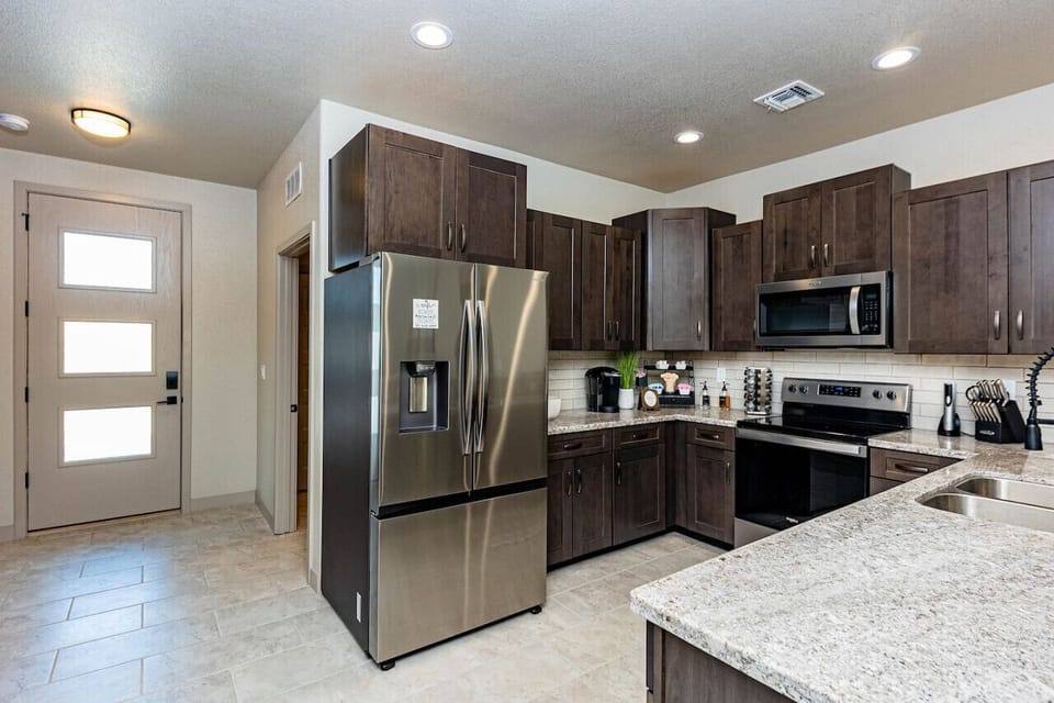 The kitchen is fully equipped, perfect for preparing meals or entertaining guests.