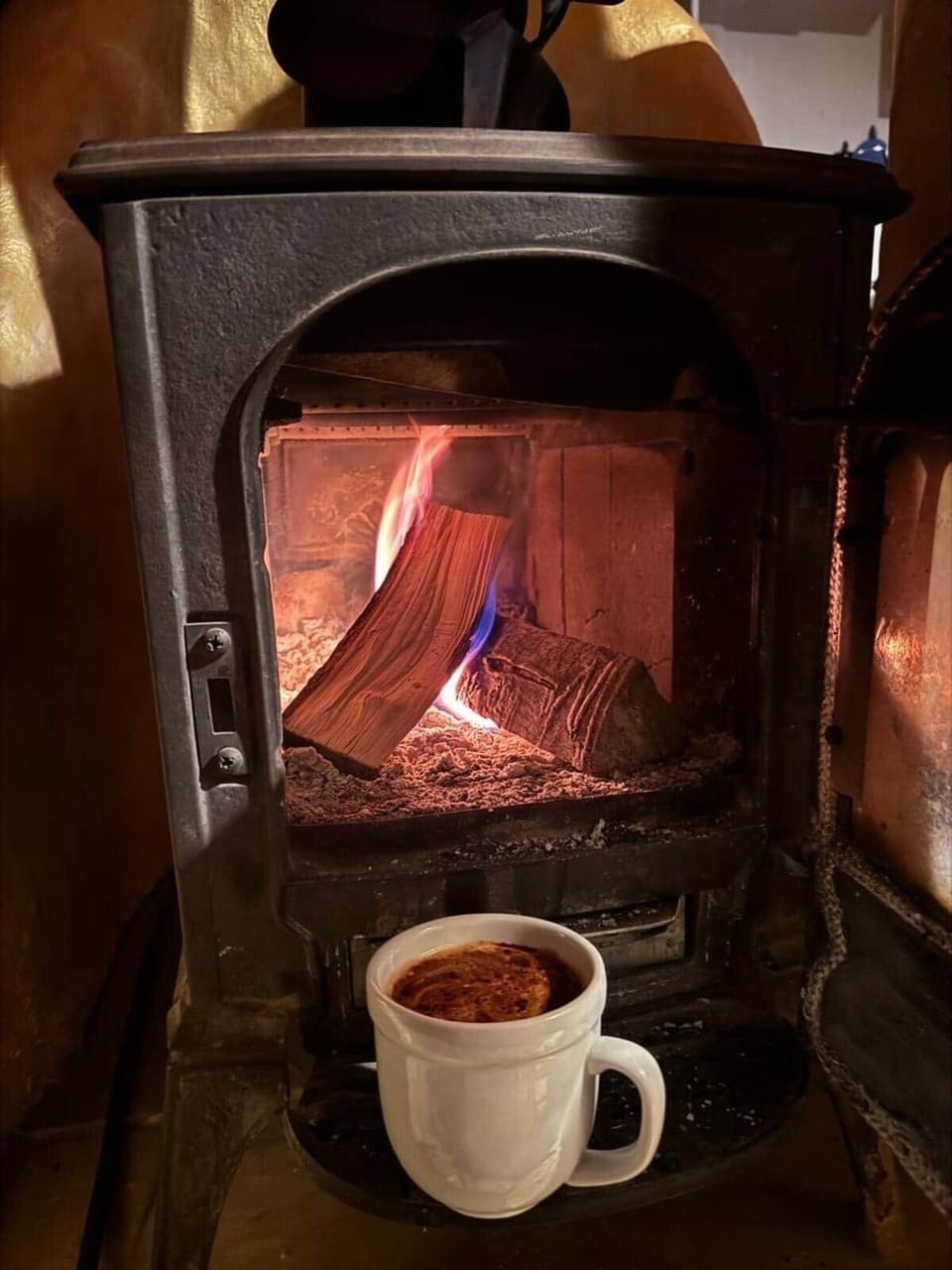 A rustic wood fireplace evokes simpler times.