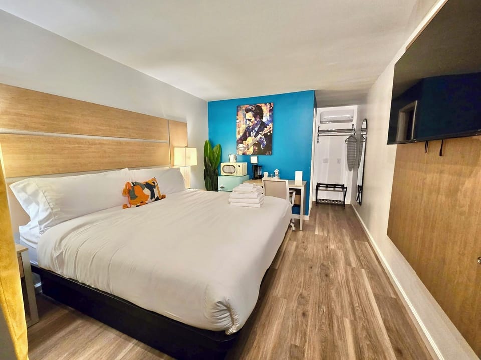 Design Room | Desk, laptop workspace, blackout drapes, iron/ironing board