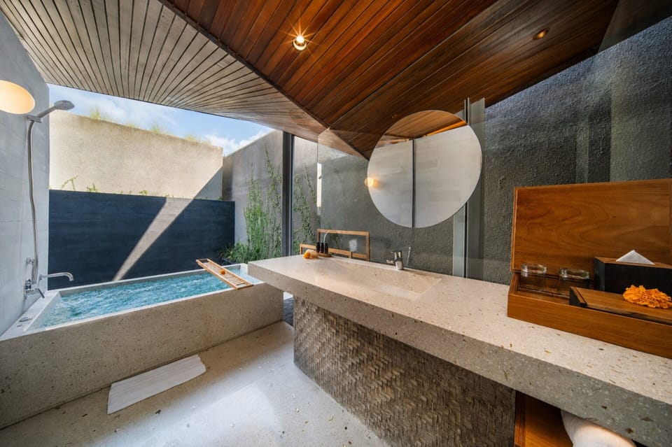 Separate tub and shower, hair dryer, bathrobes, slippers