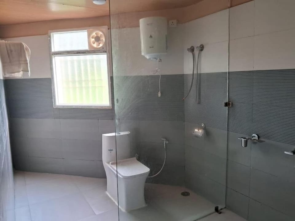 Premium Cottage, Balcony, Garden View | Bathroom | Shower, free toiletries, hair dryer, towels