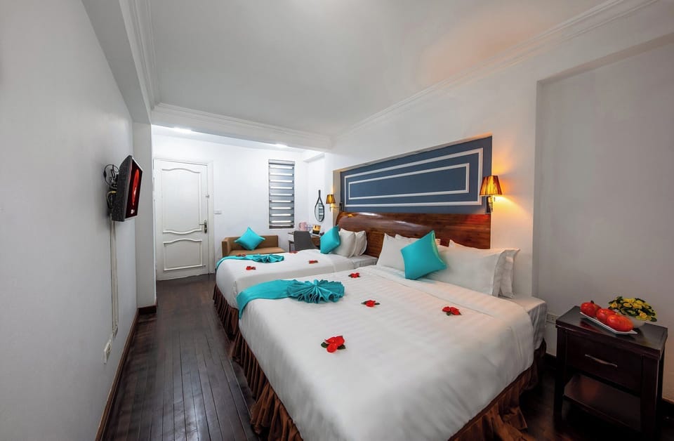 Deluxe Triple Room, 1 Bedroom, Non Smoking | Hypo-allergenic bedding, minibar, in-room safe, desk
