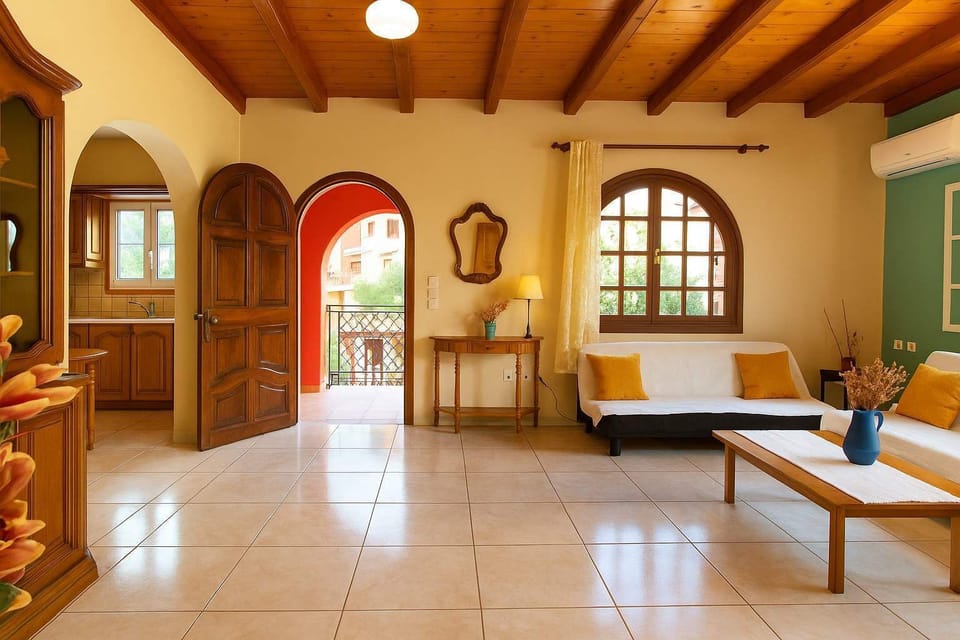 Spacious Living Room with Welcoming Atmosphere – High ceilings, natural light, and classic décor for a homely feel.