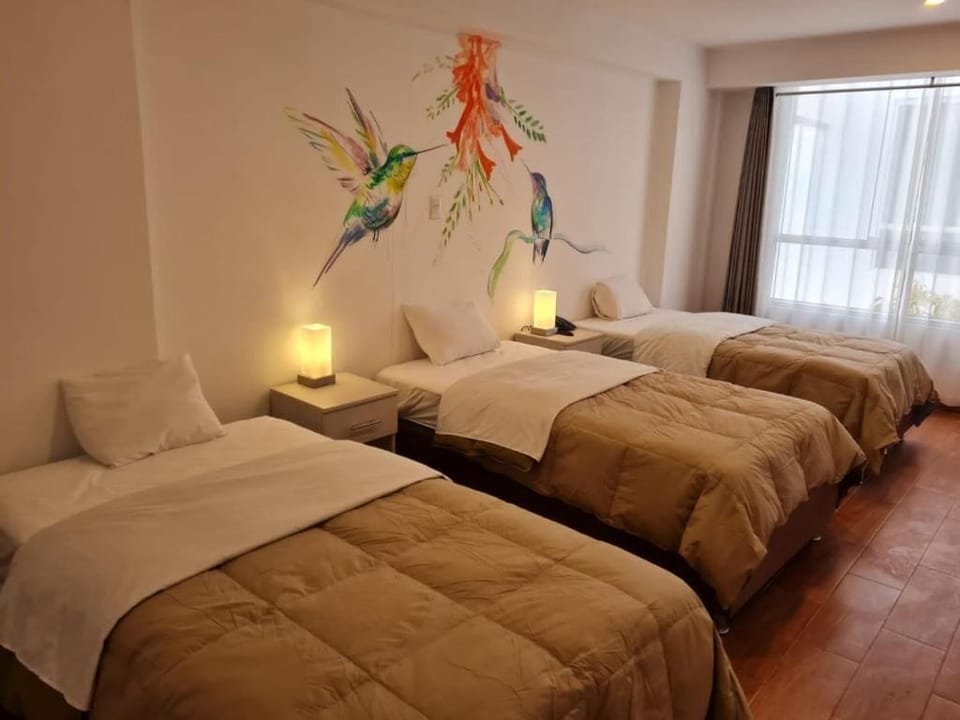 Basic Quadruple Room | Down comforters, free WiFi