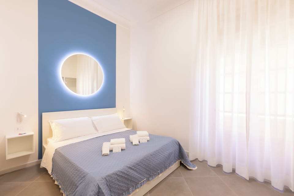 Deluxe Double Room, Balcony, City View | Minibar, in-room safe, desk, laptop workspace