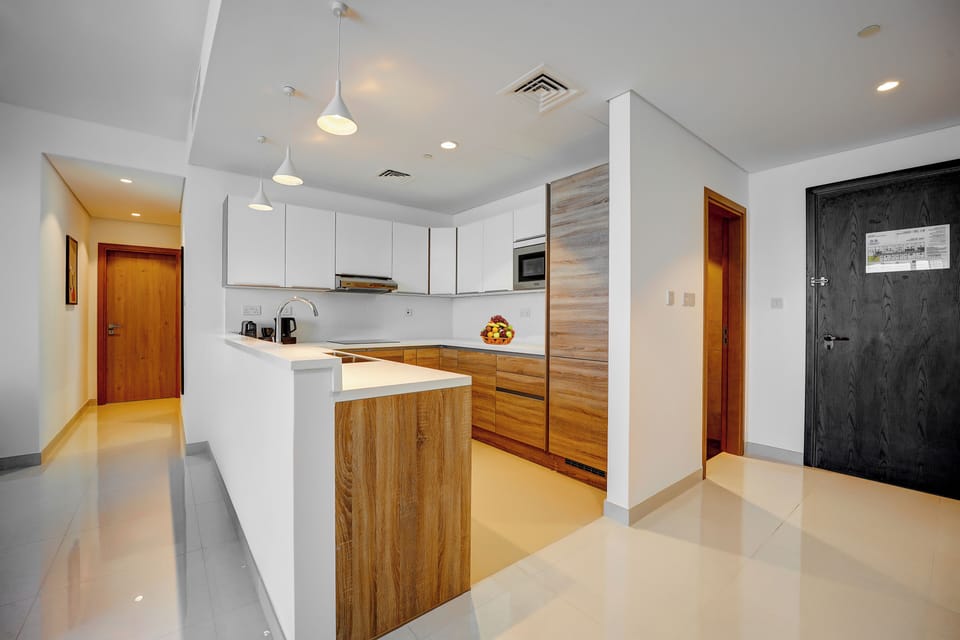 Two Bedrooms, Sea View | Living area | 55-inch Smart TV with satellite channels