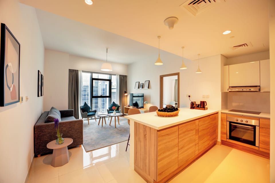 One Bedroom City View | Living area | 55-inch Smart TV with satellite channels