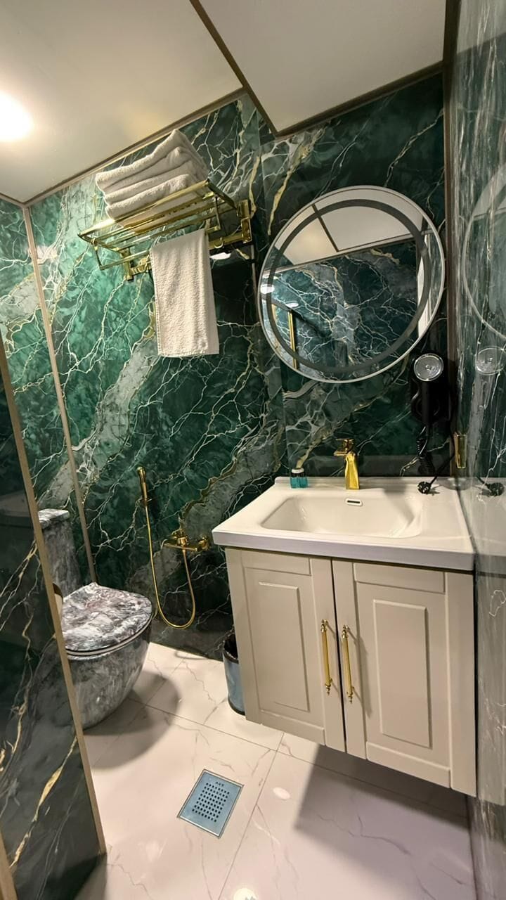 Shower, free toiletries, hair dryer, slippers