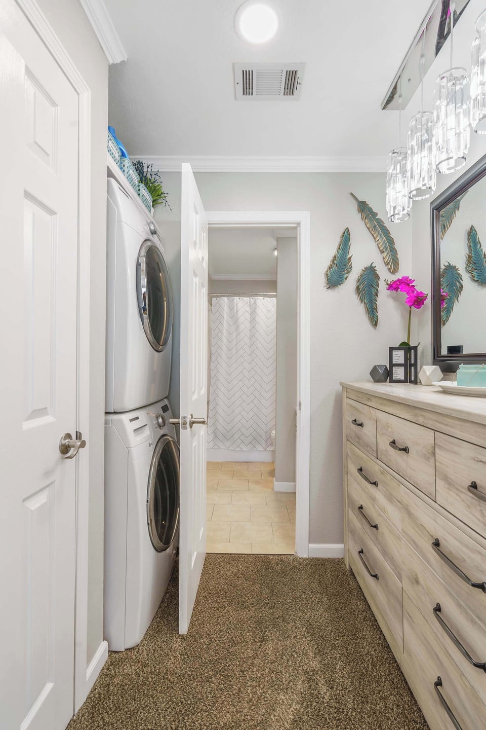 Bathroom shared en-suite with shower/tub combo, stackable washer & dryer, accessible from living area also