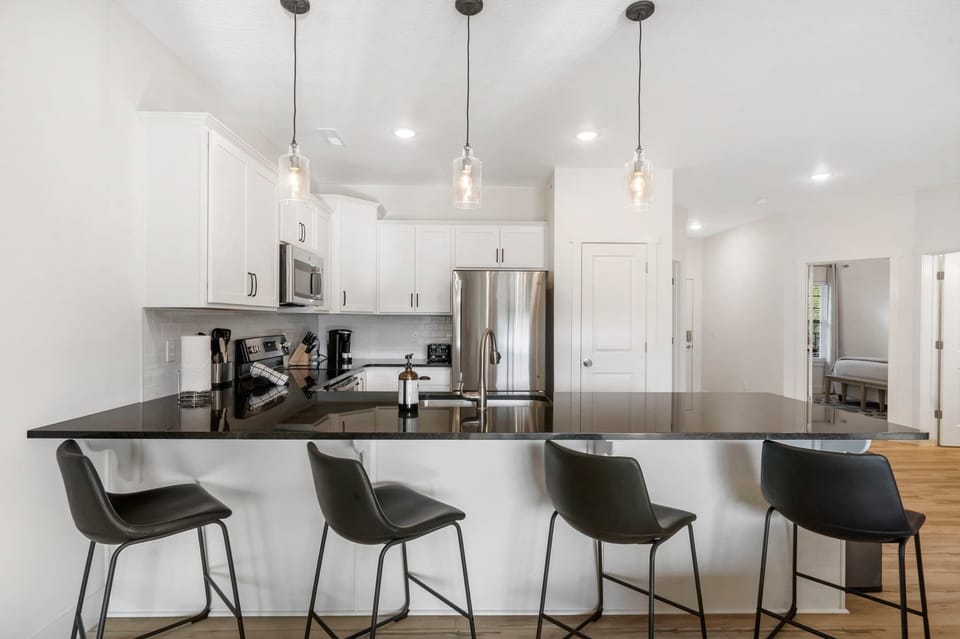 Enjoy morning coffee at the counter, offering seating for 4