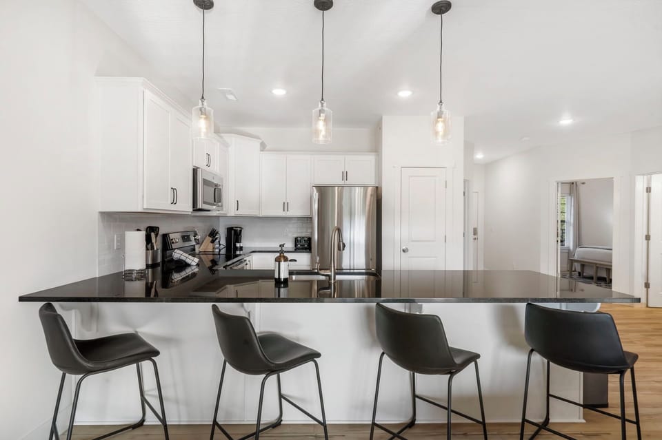 Enjoy morning coffee at the counter, offering seating for 4