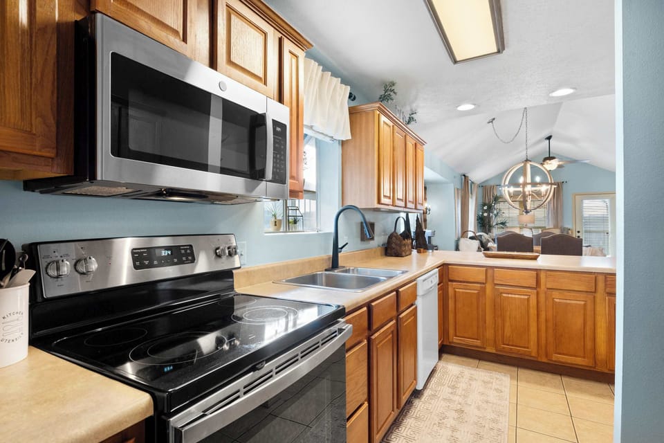 The inviting kitchen offers ample space & all the comforts of home