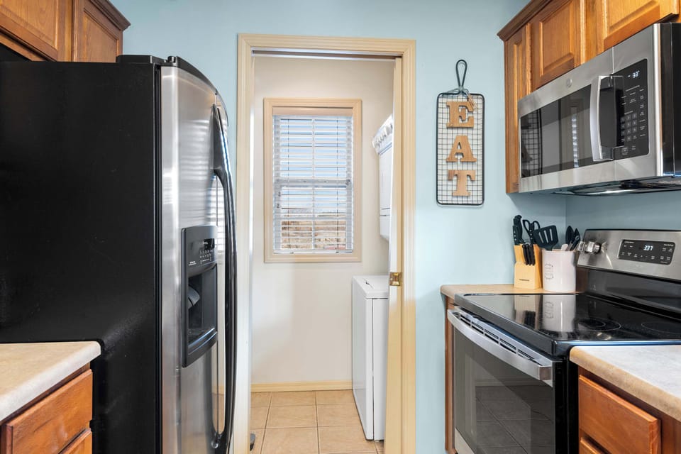 The inviting kitchen offers ample space & all the comforts of home