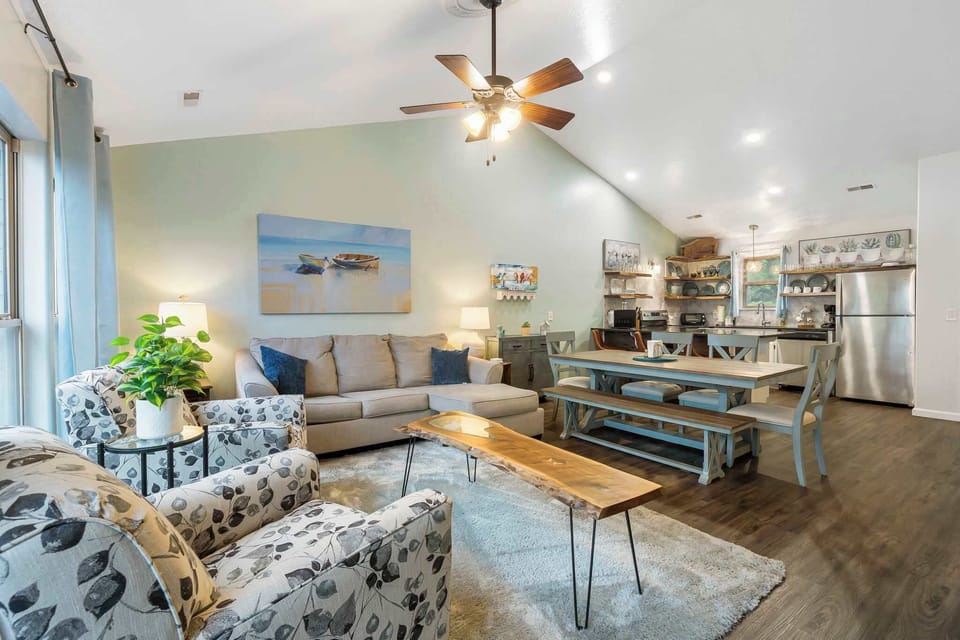 The spacious, airy Living/Dining Room and Kitchen offer abundant space, light, and amenities