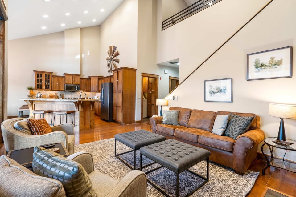 Bright living space with ample seating and TV