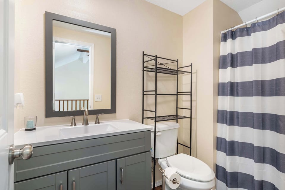 The final full bath includes a single vanity & walk in shower
