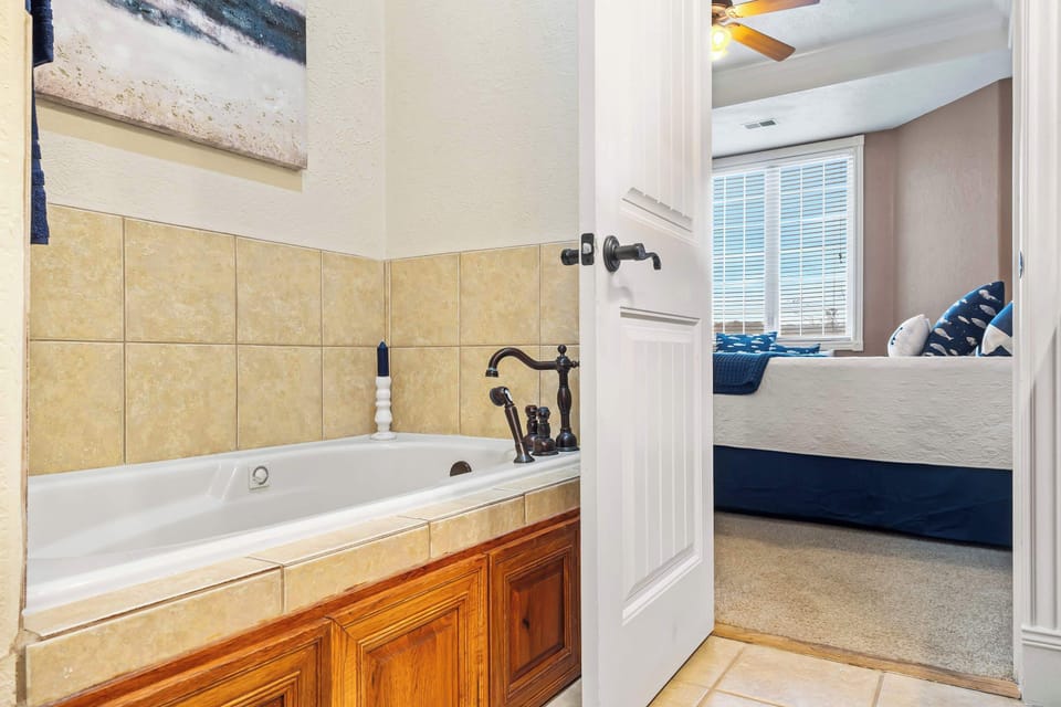 Bathroom 2 en-suite with double vanity, separate shower, and soaking tub