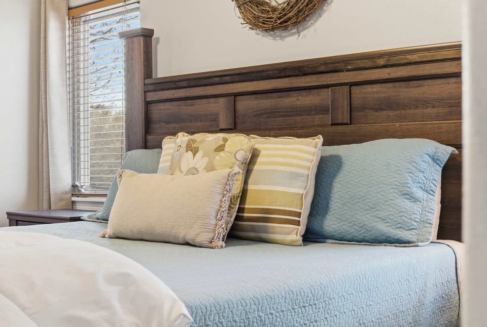 Bedroom 2 with King bed, TV, and private en-suite