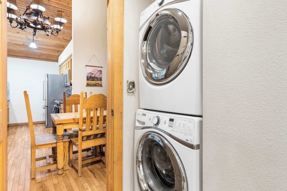 Shared ensuite with separate shower and tub, and stackable washer & dryer