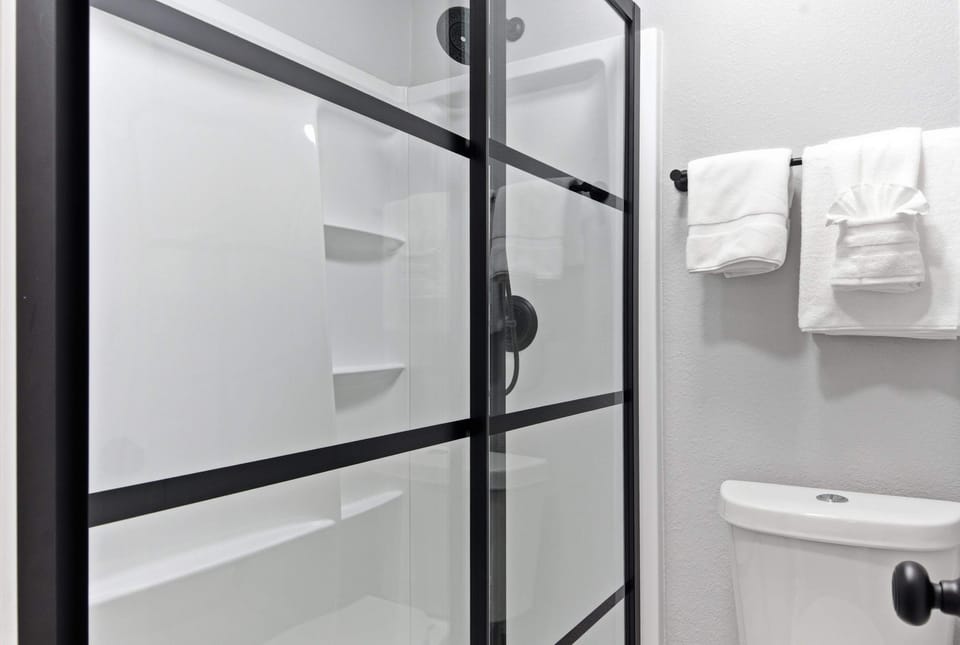 The 2nd ensuite bathroom offers a large single vanity & shower/tub combo