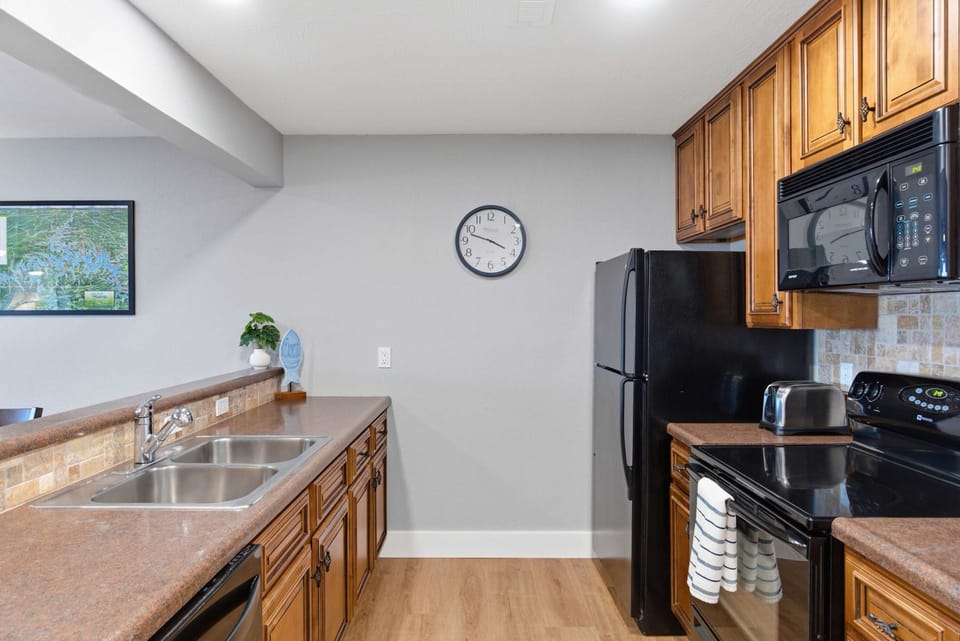 The spacious kitchen offers ample space & all the comforts of home