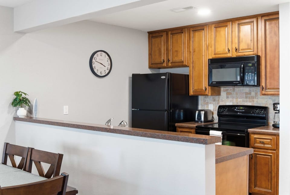 The spacious kitchen offers ample space & all the comforts of home
