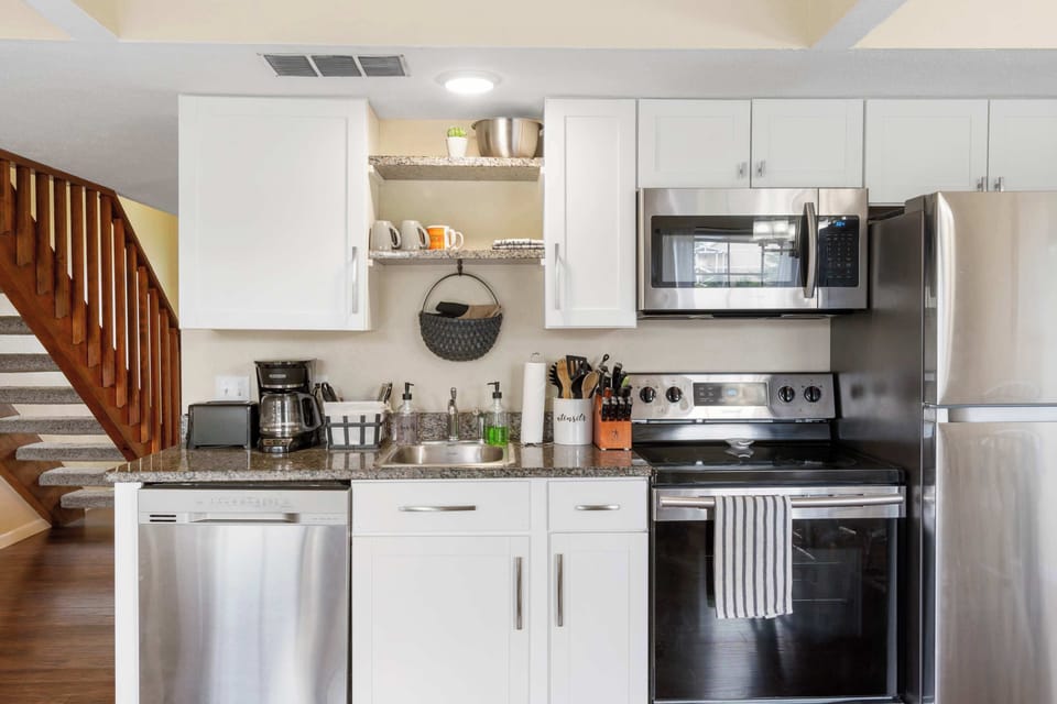 The open, airy kitchen area offers ample space & all the comforts of home