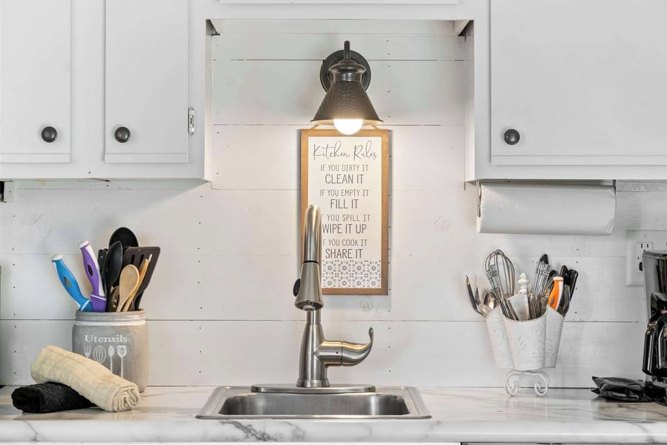 The open kitchen offers ample storage space & all the comforts of home