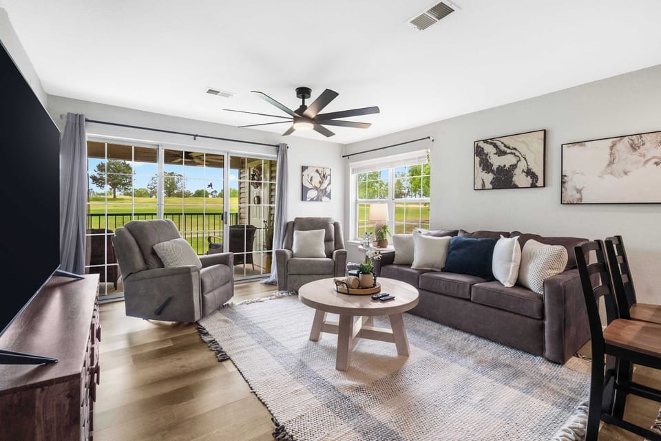 Bright airy living space with sofa sleeper and Smart tv.