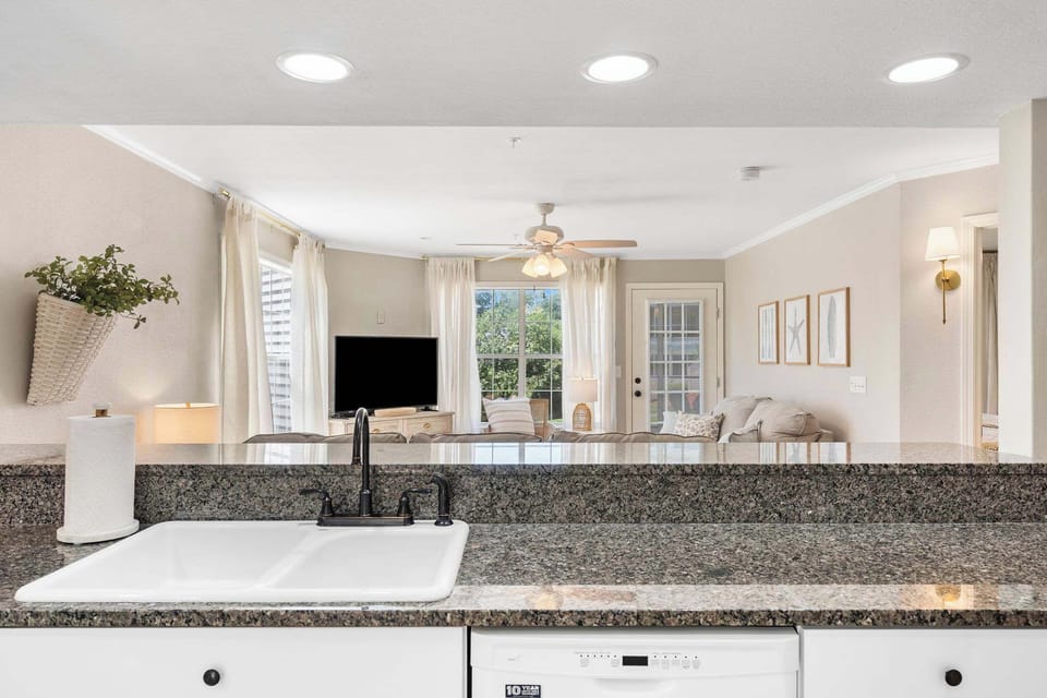 The open, well-equipped kitchen offers plenty of storage & counter space