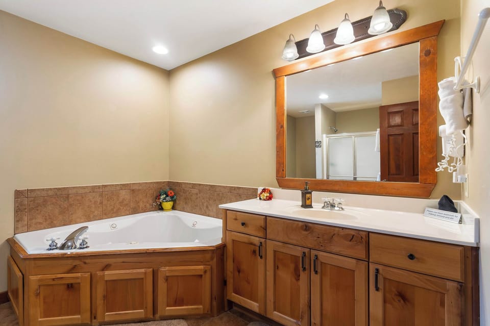 En-suite with separate soaking tub, and stand up shower