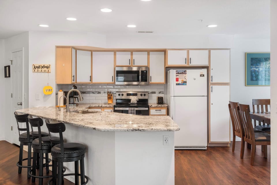 The airy kitchen offers ample space & all the comforts of home