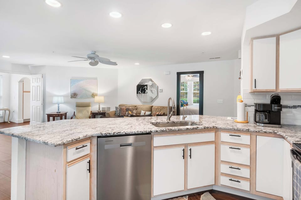 The airy kitchen offers ample space & all the comforts of home