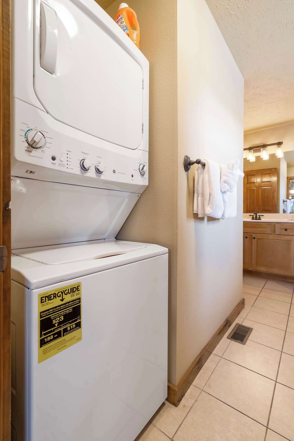 Bathroom 1 shared en-suite with jetted tub, walk-in shower, and stackable washer & dryer (1st floor)